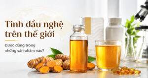 Tinh dầu nghệ trên thế giới với chai tinh dầu nghệ, củ nghệ tươi, viên nang và ly đồ uống wellness màu vàng.